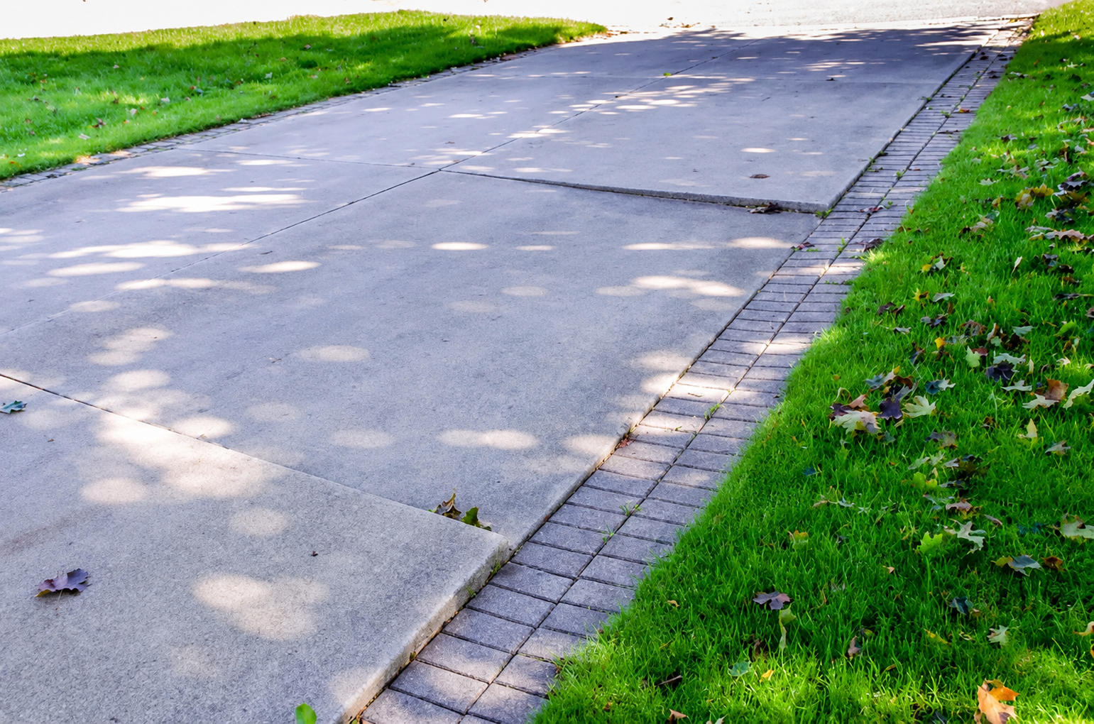 Newly leveled modern residential concrete driveway
